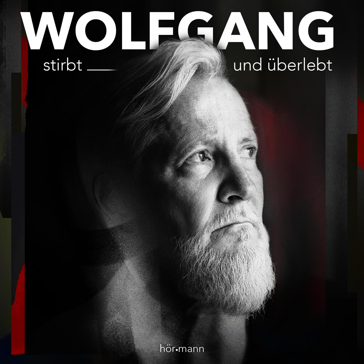 Ein Mann mit Bart sieht in die Ferne